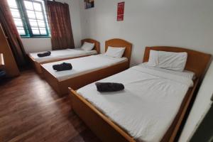 Postel nebo postele na pokoji v ubytování Hotel Check Inn 2