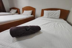 Postel nebo postele na pokoji v ubytování Hotel Check Inn 2