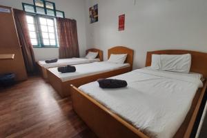 Postel nebo postele na pokoji v ubytování Hotel Check Inn 2
