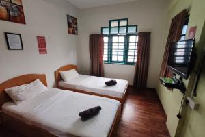 Postel nebo postele na pokoji v ubytování Hotel Check Inn 2