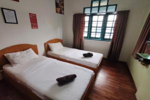 Postel nebo postele na pokoji v ubytování Hotel Check Inn 2