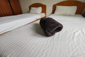 Postel nebo postele na pokoji v ubytování Hotel Check Inn 2
