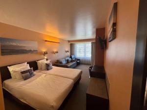 Postel nebo postele na pokoji v ubytování Hotel Uilenspiegel