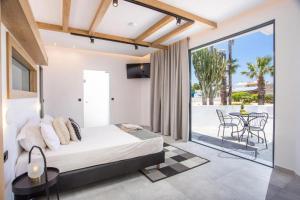 Posteľ alebo postele v izbe v ubytovaní Cactus Suites
