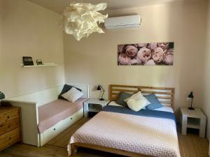 Postel nebo postele na pokoji v ubytování Szélcsend Apartman