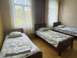 Postel nebo postele na pokoji v ubytování Tsikhisdziri Hotel