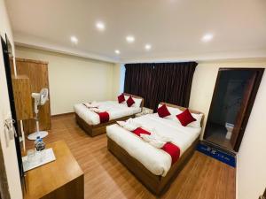Postel nebo postele na pokoji v ubytování pashupati front hotel