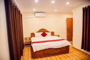 Postel nebo postele na pokoji v ubytování pashupati front hotel