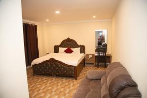Postel nebo postele na pokoji v ubytování pashupati front hotel