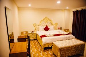 Postel nebo postele na pokoji v ubytování pashupati front hotel