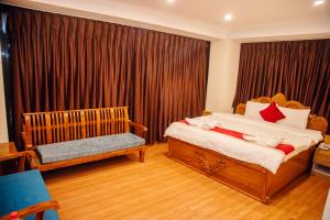 Postel nebo postele na pokoji v ubytování pashupati front hotel