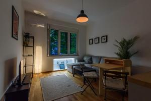 a living room with a couch and a table at Studio 44 in Belgrade