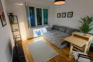 a living room with a couch and a table at Studio 44 in Belgrade