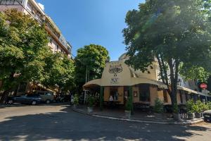 a restaurant with an umbrella on a city street at Studio 44 in Belgrade