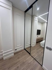 TV/trung tâm giải trí tại Aquamarine Luxury Apartment290 +2 ảnh