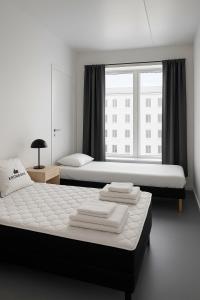 En eller flere senge i et værelse på Talle-Central Apartment Odense C
