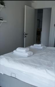 two stacks of towels sitting on top of a bed at Bedroom flat Caesar resort, Iskele north Cyprus in Vrysoules +17 photos
