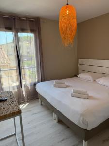 Postel nebo postele na pokoji v ubytování Hotel Aquarius