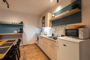 Kuchyň nebo kuchyňský kout v ubytování Apartmán Pod Kopečkem