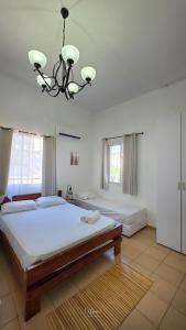 Postel nebo postele na pokoji v ubytování Hotel Loui Talpiot