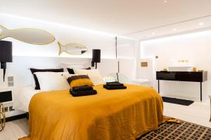 a bedroom with a large bed and a piano at Luxury Duplex 2BR Panoramic Sea View Monaco in Beausoleil