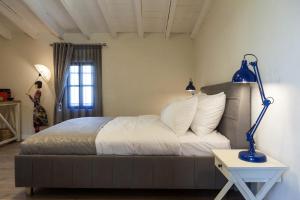 Postel nebo postele na pokoji v ubytování Carmel Pearl