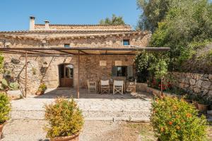 an external view of a stone house with a patio at The Old Cottage - Cas Julians Sencelles Ruberts in Sencelles