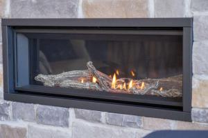 a fireplace is shown with flames in it at Spa - Chalet la Barque du Bonheur in Sainte-Germaine-du-Lac-Etchemin