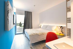 Cama ou camas em um quarto em Pharos Hvar Bayhill Hotel