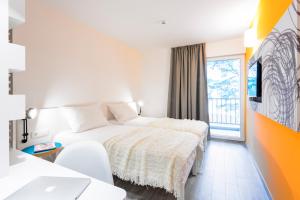 Cama ou camas em um quarto em Pharos Hvar Bayhill Hotel