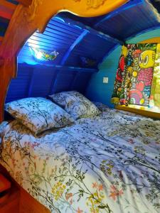 a bedroom with a bed in a tent at Roulotte LA Bohémienne in Grosbreuil