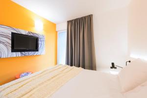Cama ou camas em um quarto em Pharos Hvar Bayhill Hotel