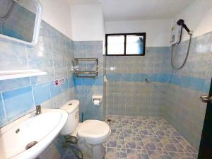 a bathroom with a toilet and a sink and a shower at Patong Canal Villa R201 in Patong Beach +9 photos