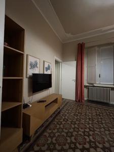 a living room with a flat screen tv on the wall at ATELIER in Voghera