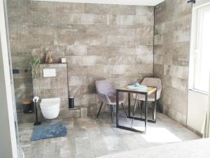 Koupelna v ubytování Luxe kamer met stoomsauna bij B&B Gezond aan Zee - Toegang bad en buiten Wellness tegen meerprijs