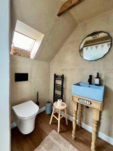 a bathroom with a toilet and a sink at The Blue Loft in Anstruther +46 photos