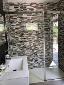 a bathroom with a sink and a glass shower at CASA MAR DE LUNA 2 en raxo in Raxo +118 photos
