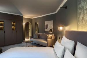 Tempat tidur dalam kamar di ERIKA Boutiquehotel Kitzbühel