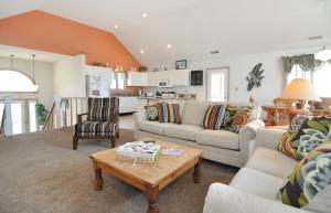 a living room with a couch and a table at Z Breeze in Nags Head