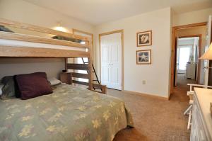 a bedroom with two bunk beds and a bed at Z Breeze in Nags Head