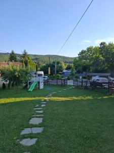 a walkway in a park with a playground at La Foisor in Vărbilău