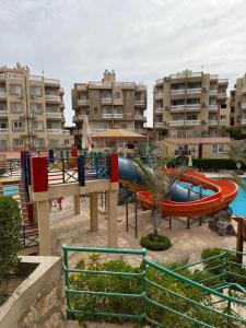 a water park with a water slide and slides at Family Chalet Pool & Aqua-Park Access in Sharm El Sheikh in Sharm El Sheikh +10 photos