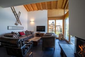a living room with a couch and a fireplace at Ski Paradise SP 011 - MOUNTAIN apartment 6 pers in Veysonnaz