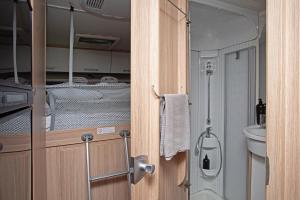 a bathroom with a shower and a toilet and a sink at Encar - Bliżej nie będzie in Zator