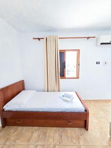 Voodi või voodid majutusasutuse Azure Hotel Dhermi toas