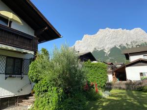 a view of a house with a mountain in the background at Ferienhaus Greti Ehrwald in Ehrwald