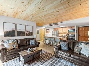 a living room with a couch and a table at Ski In and Out, Luxury, 1 Blk to Main, Pool, Hot Tub, Sauna in Breckenridge