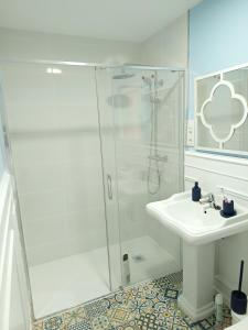 a white bathroom with a shower and a sink at Casa La Vuelta in Águilas +22 photos