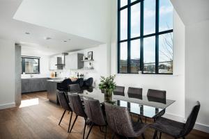 a kitchen and dining room with a table and chairs at Minety Lake 72 ML72 Lower Mill Estate Cotswolds in Somerford Keynes