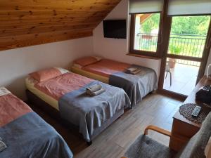 Postel nebo postele na pokoji v ubytování Sunny Lake House Warmia i Mazury jezioro Dadaj + 19 fotografií